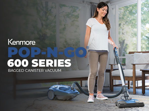 Woman using Kenmore Pop-N-Go 600 Series bagged canister vacuum in a room.