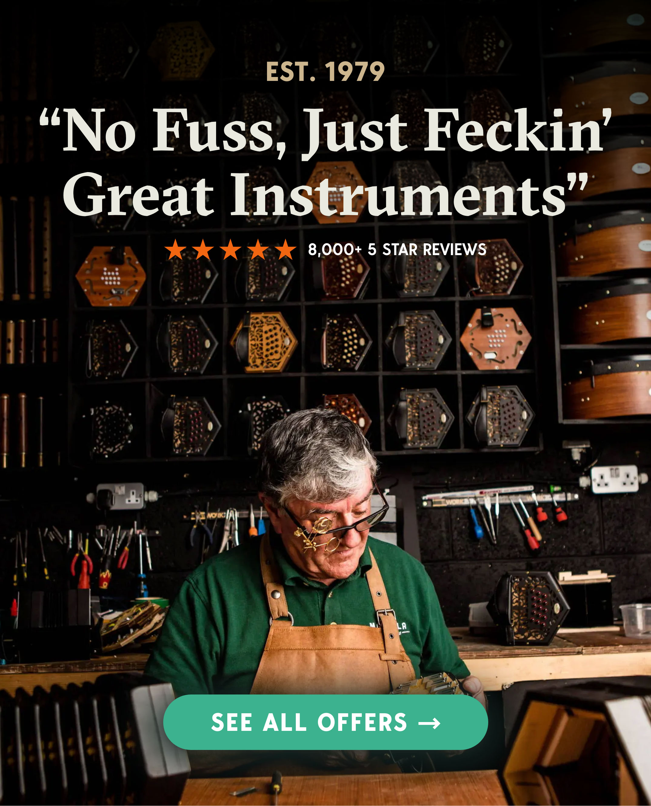 Person working on musical instruments with tools and product display in background.
