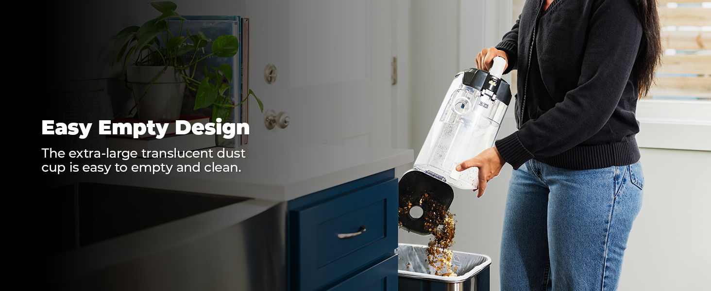 Person demonstrating easy empty design of a vacuum cleaner.
