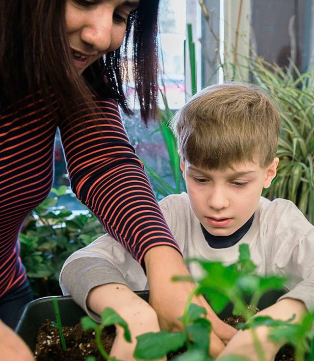 Little Green Thumbs program: teacher and student planting