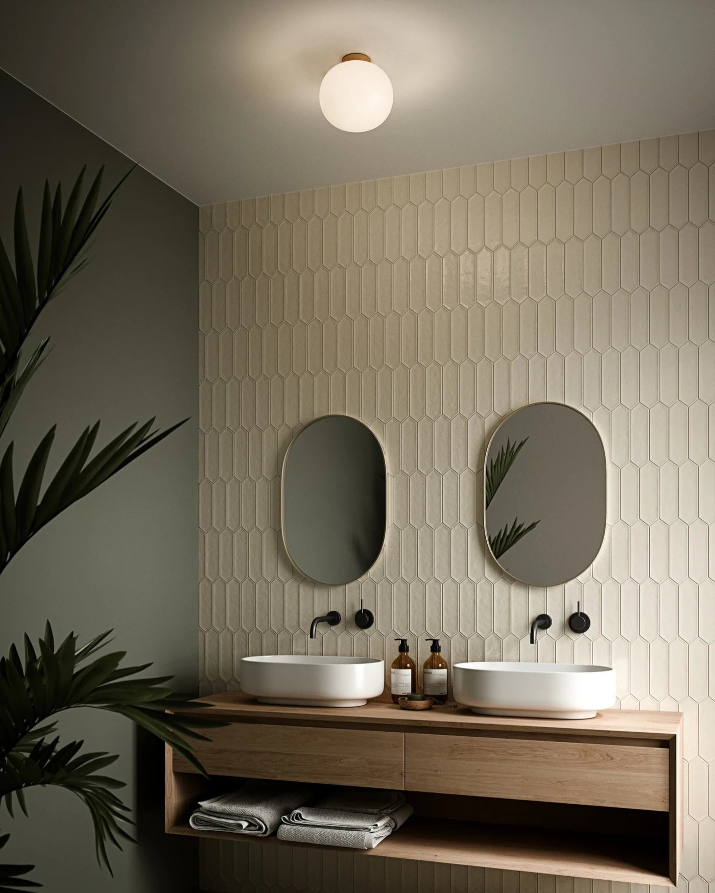 Simple Scandinavian Ceiling Light in a Bathroom with two sinks, mirrors, and decorative elements on a tiled wall - Lighting Collective 