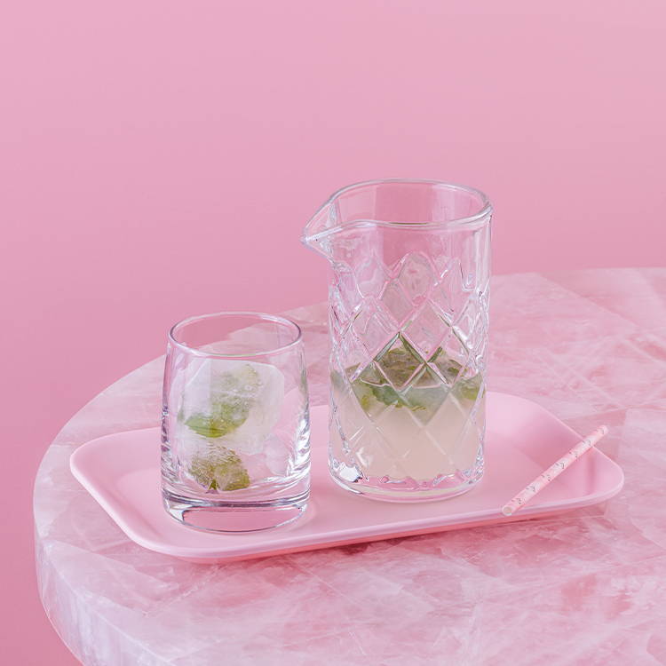 Mojito lemonade on a pink tray with mint 