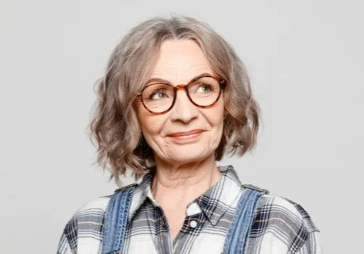 60 yr old woman wearing round coloured glasses