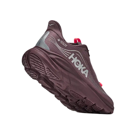 A purple running shoe with reflective details and a thick sole.