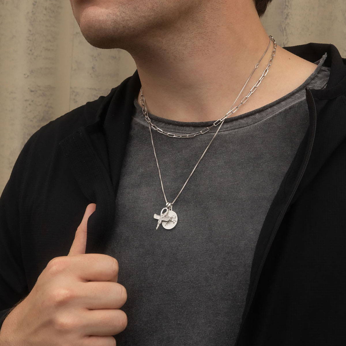 Male model wearing Leo necklace and Ankh of Isis pendant on a sterling silver box chain