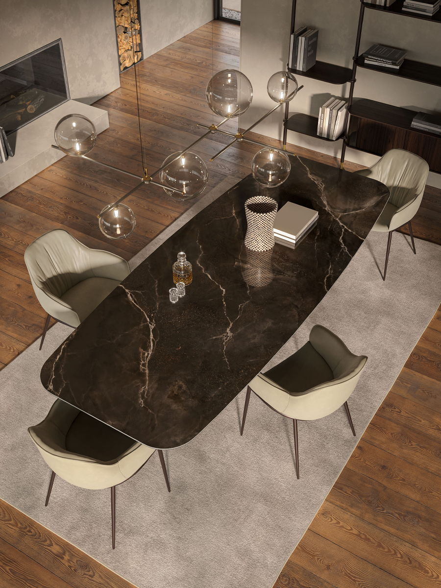 Modern dining room with an oval marble table and stylish chairs.