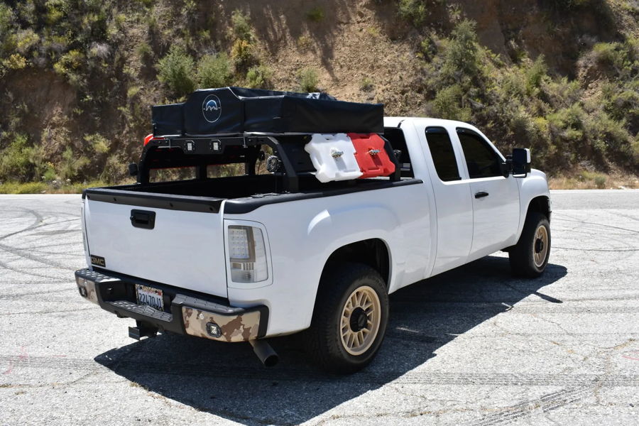 Rear three-quarter Jonathan's white 2013 GMC Sierra with bed rack RotopaX containers and rooftop tent photo 2