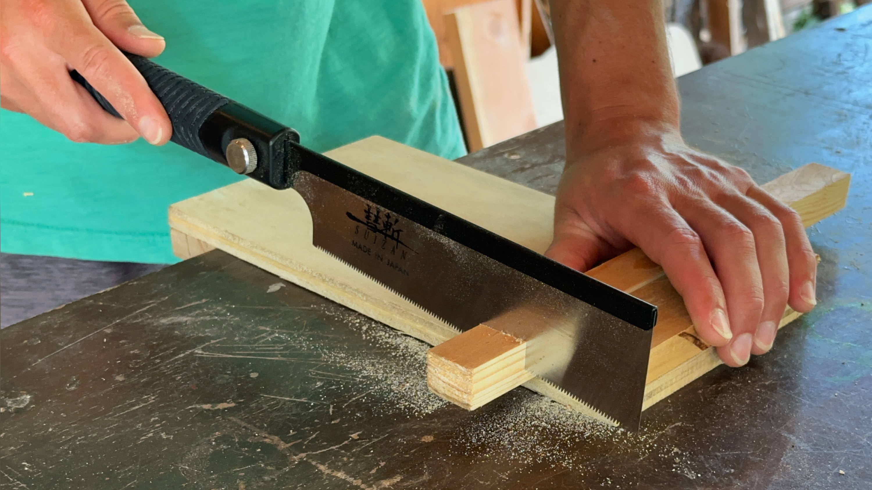 using a bench hook for hand sawing