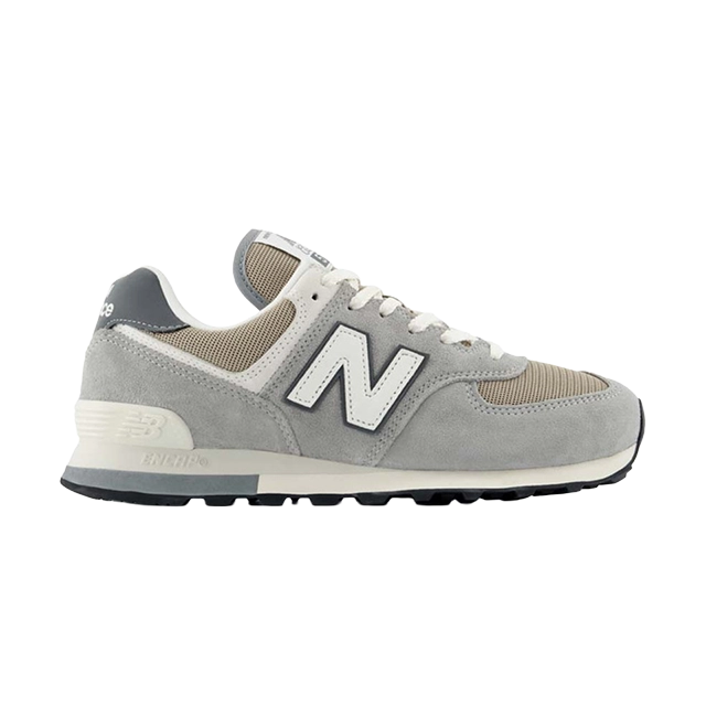 A gray New Balance sneaker with a white logo and cream accents.