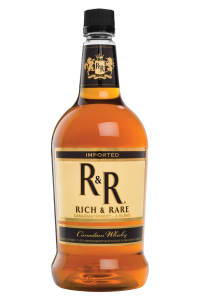 Bottle of Rich & Rare Canadian whisky with a black and gold label.
