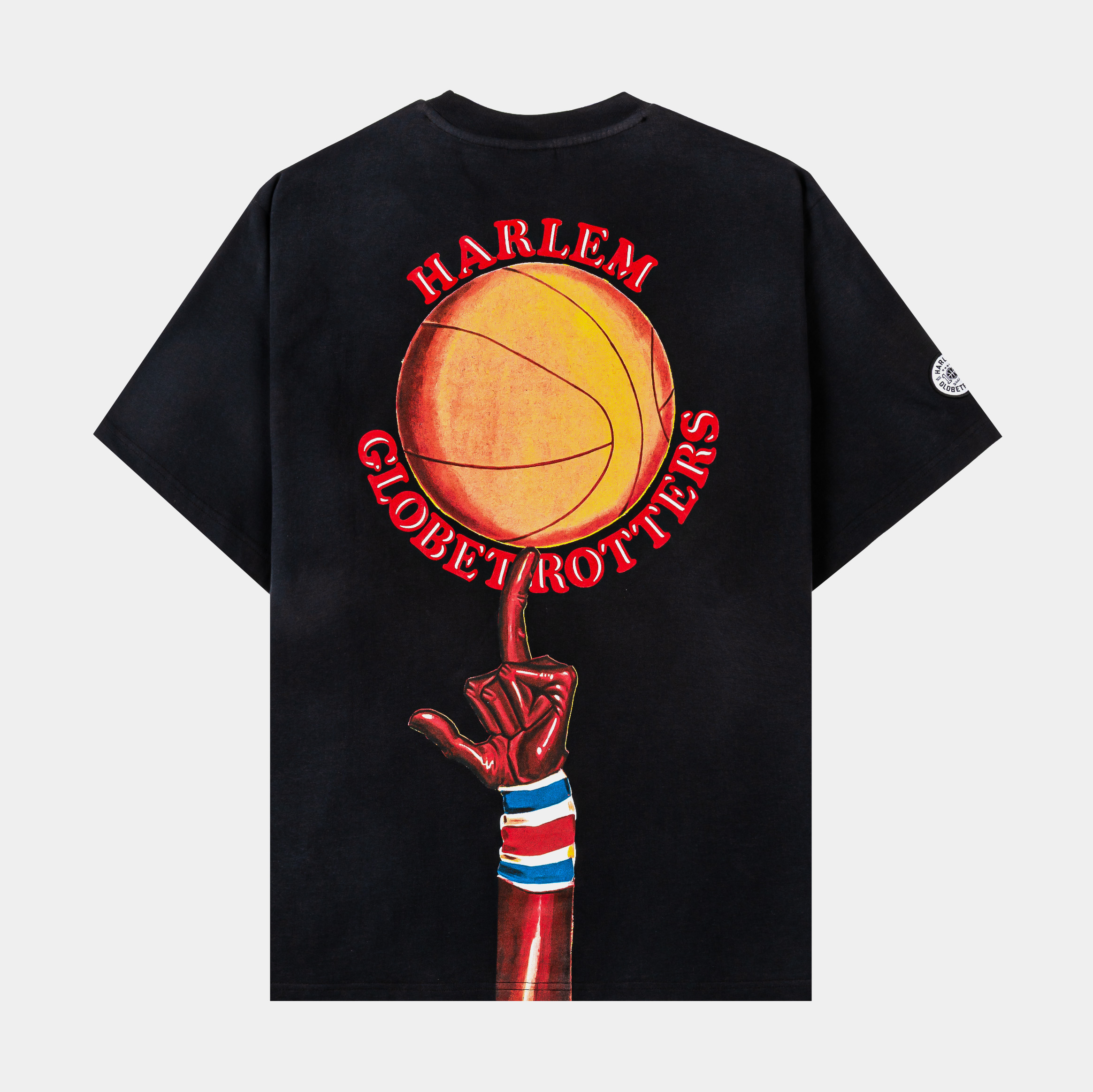 Black t-shirt featuring Harlem Globetrotters graphic with space theme.