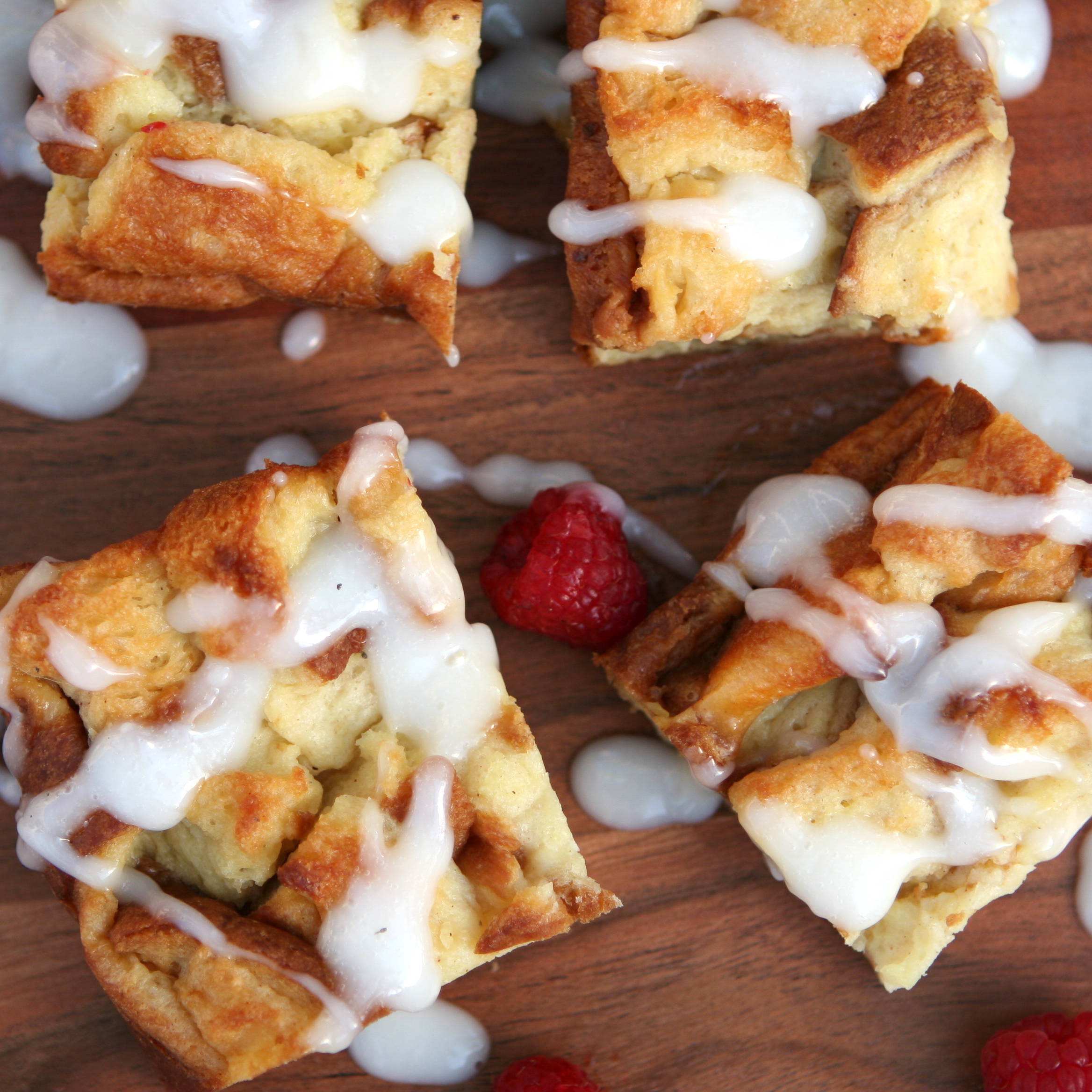 CREAMY COCONUT BREAD PUDDING WITH BERRIES AND COCONUT SYRUP DRIZZLE