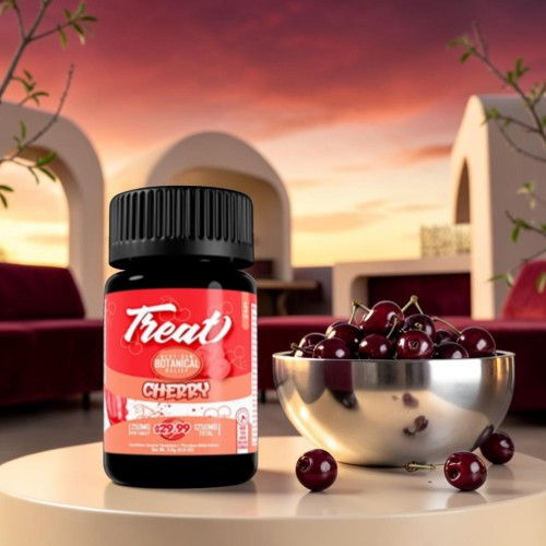 Bottle of cherry-flavored supplement next to a bowl of cherries.