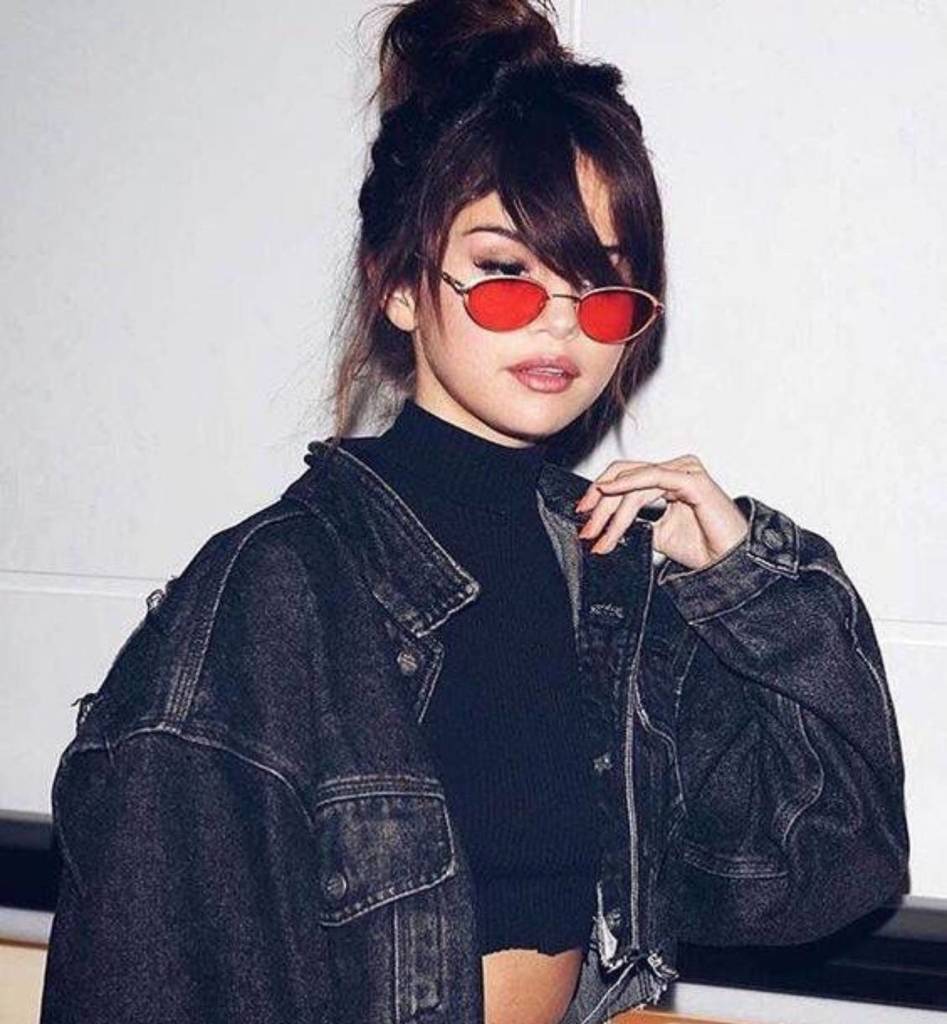 Selena Gomez wearing round sunglasses