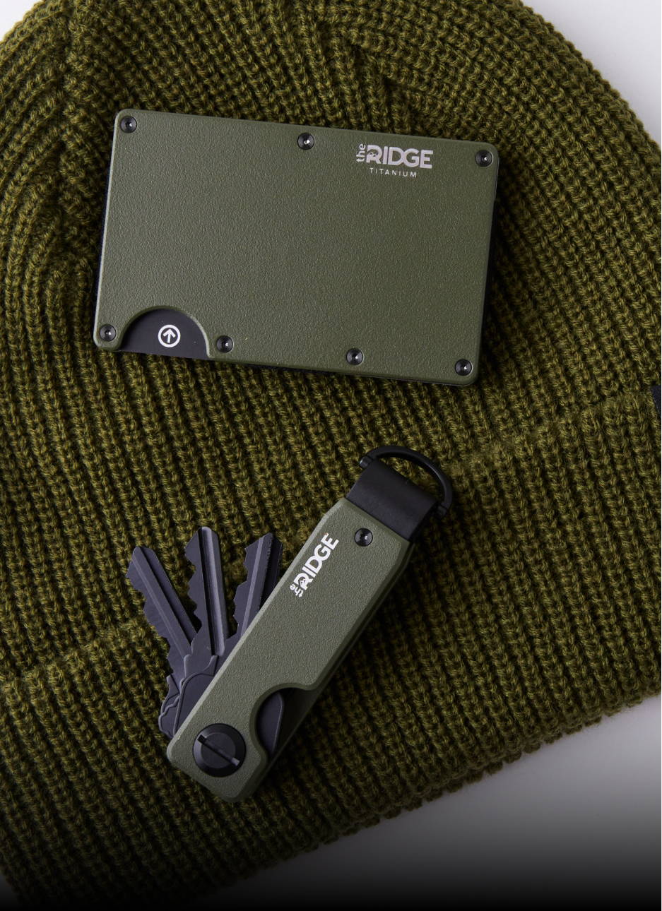 green ridge wallet and keycase on a green beanie hat
