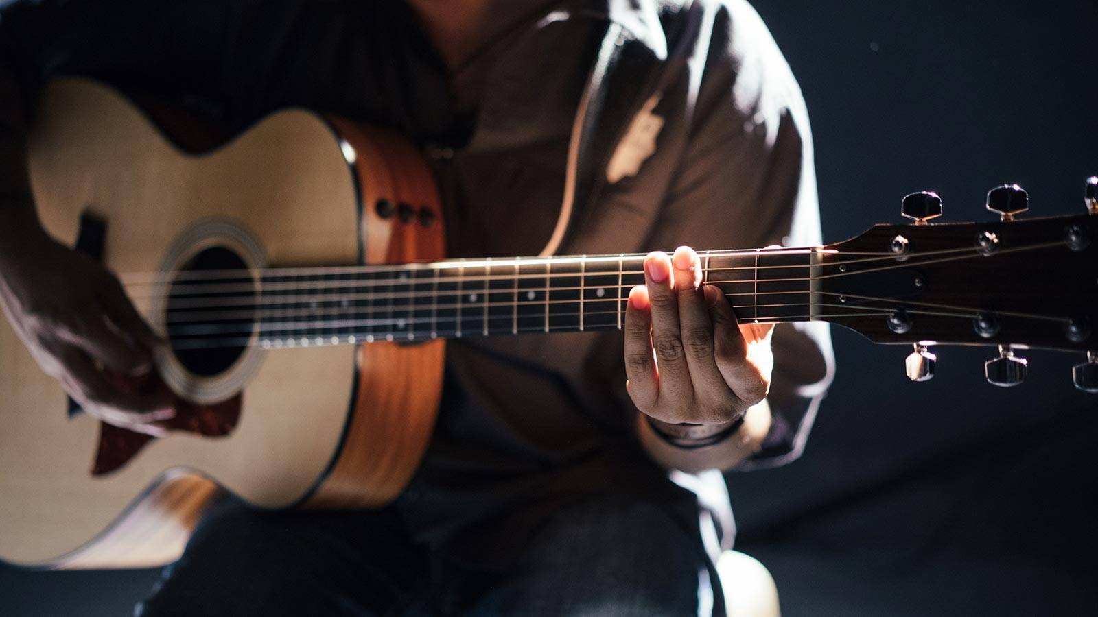 Person playing guitar