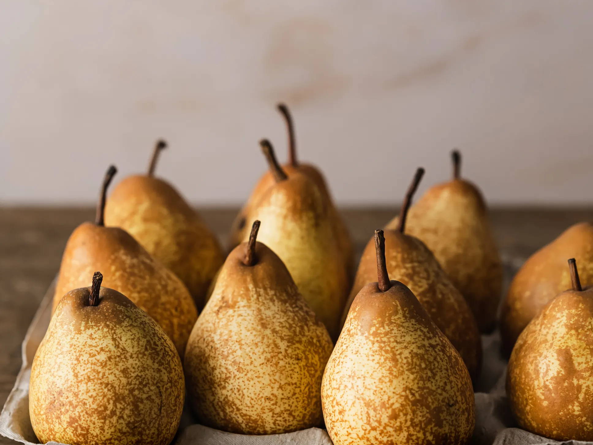A carton of golden pears