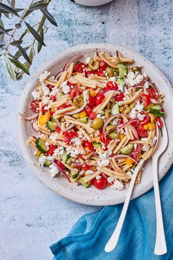 Casarecce pasta with fresh vegetables and feta in a red wine vinaigrette