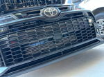 Front grille close-up with hidden horn placement behind honeycomb grille on Melissa's 2024 Toyota GR Corolla gallery photo 2