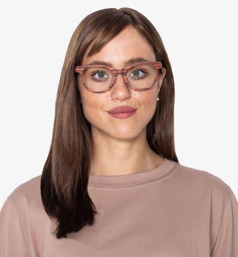 Woman wearing cat-eye wood eyeglasses frames