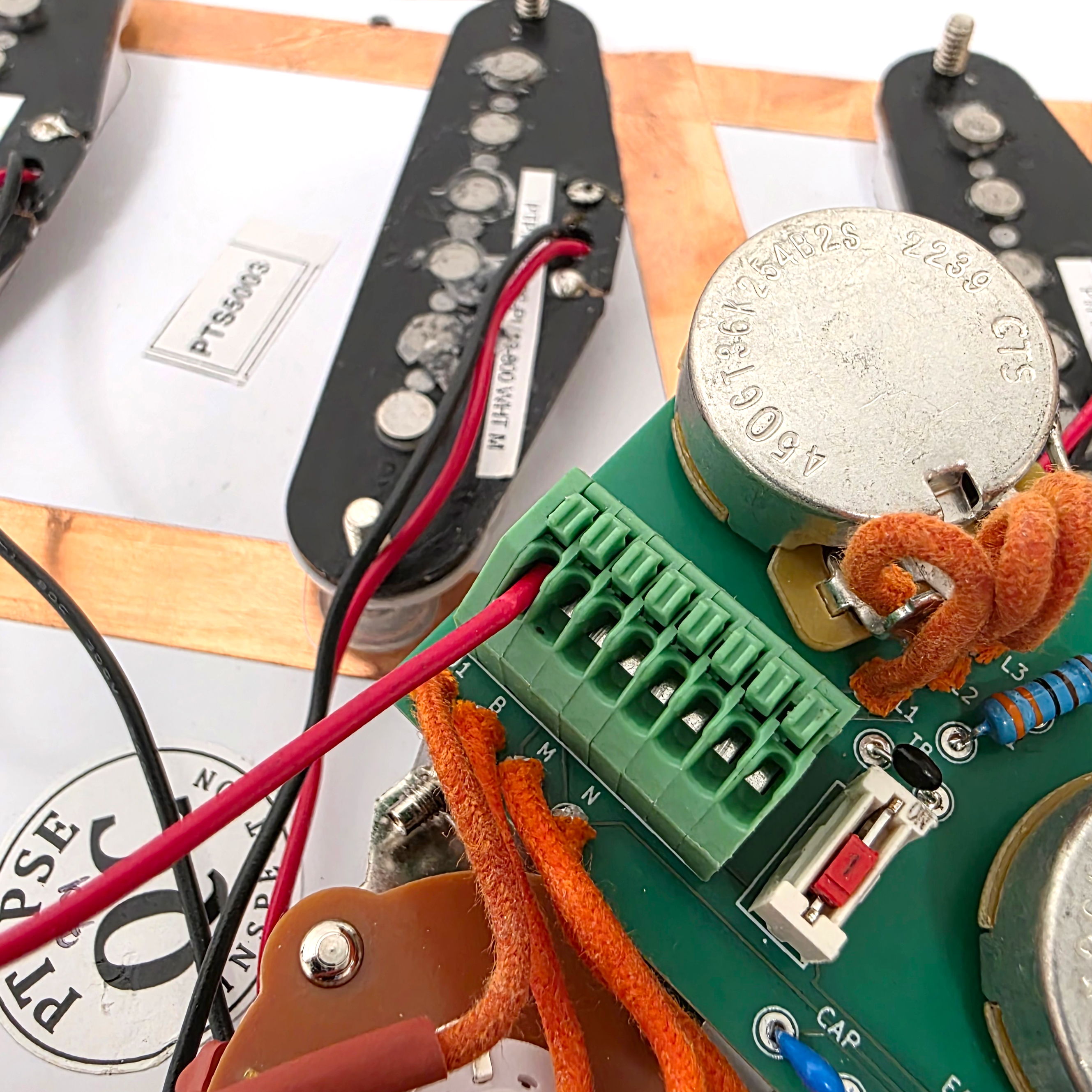 Close-up of electronic components and wires on a circuit board.