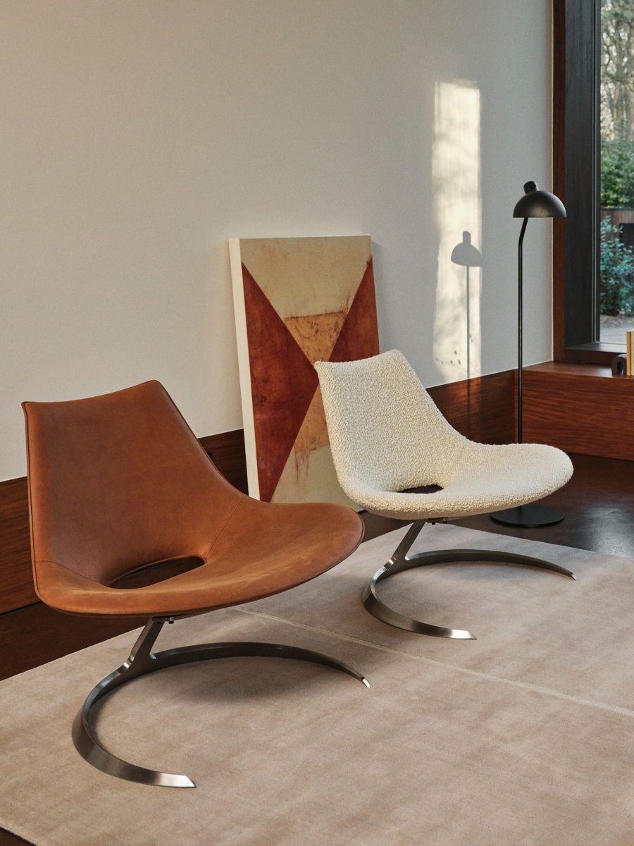 Stylish Carl hansen modern chair with a unique shape and soft upholstery.
