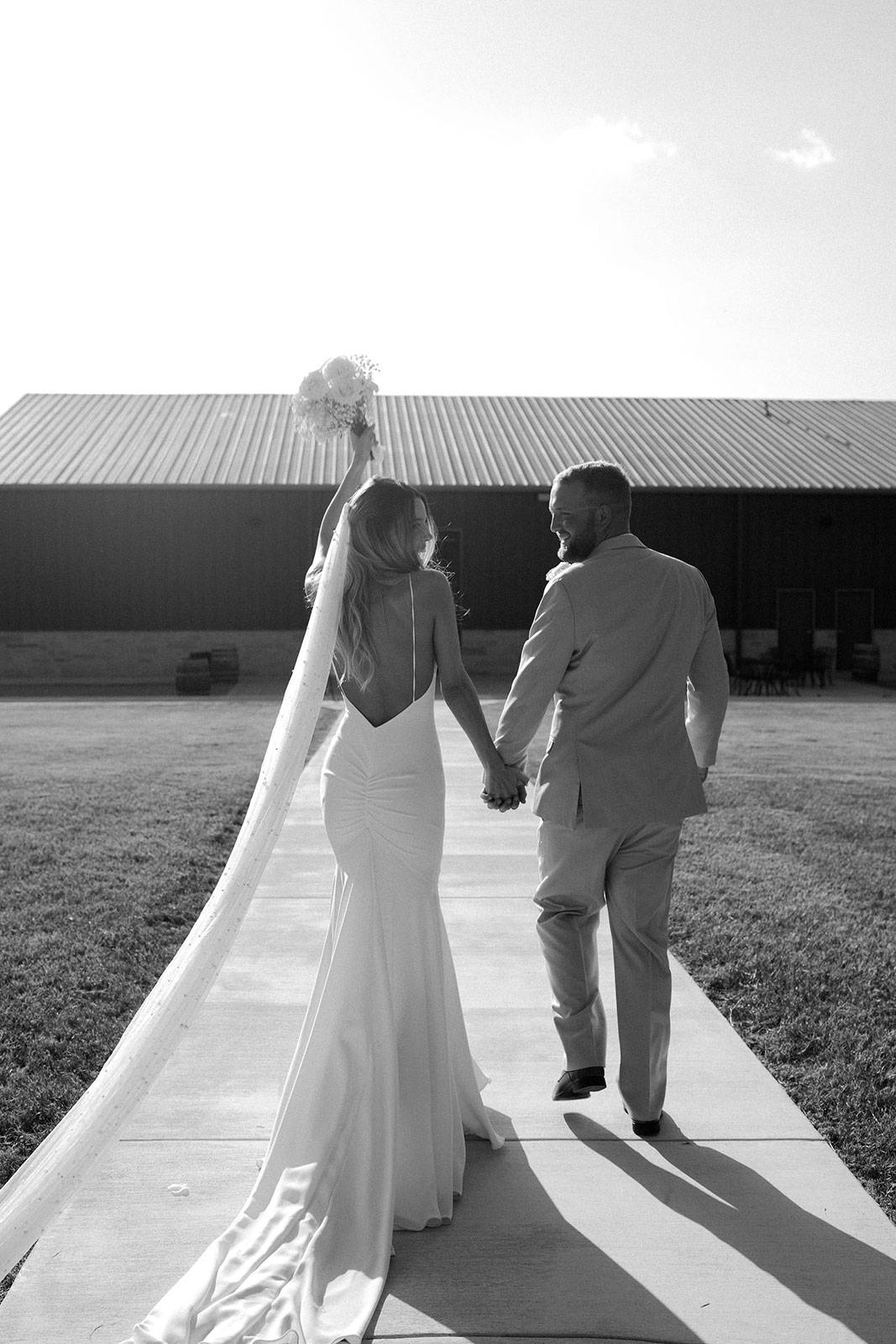 GRACE Bride Gabbie holding bouquet with husband Garrett