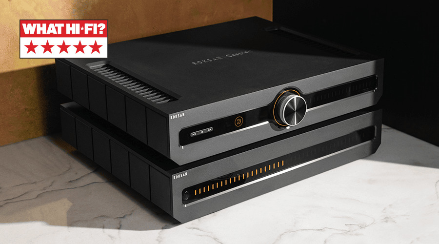 A sleek black electronic device on a countertop with a star rating.