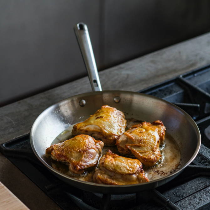 The Misen Complete Cookware Set can go from stove to oven & is perfect for a variety of dishes, including seared chicken.