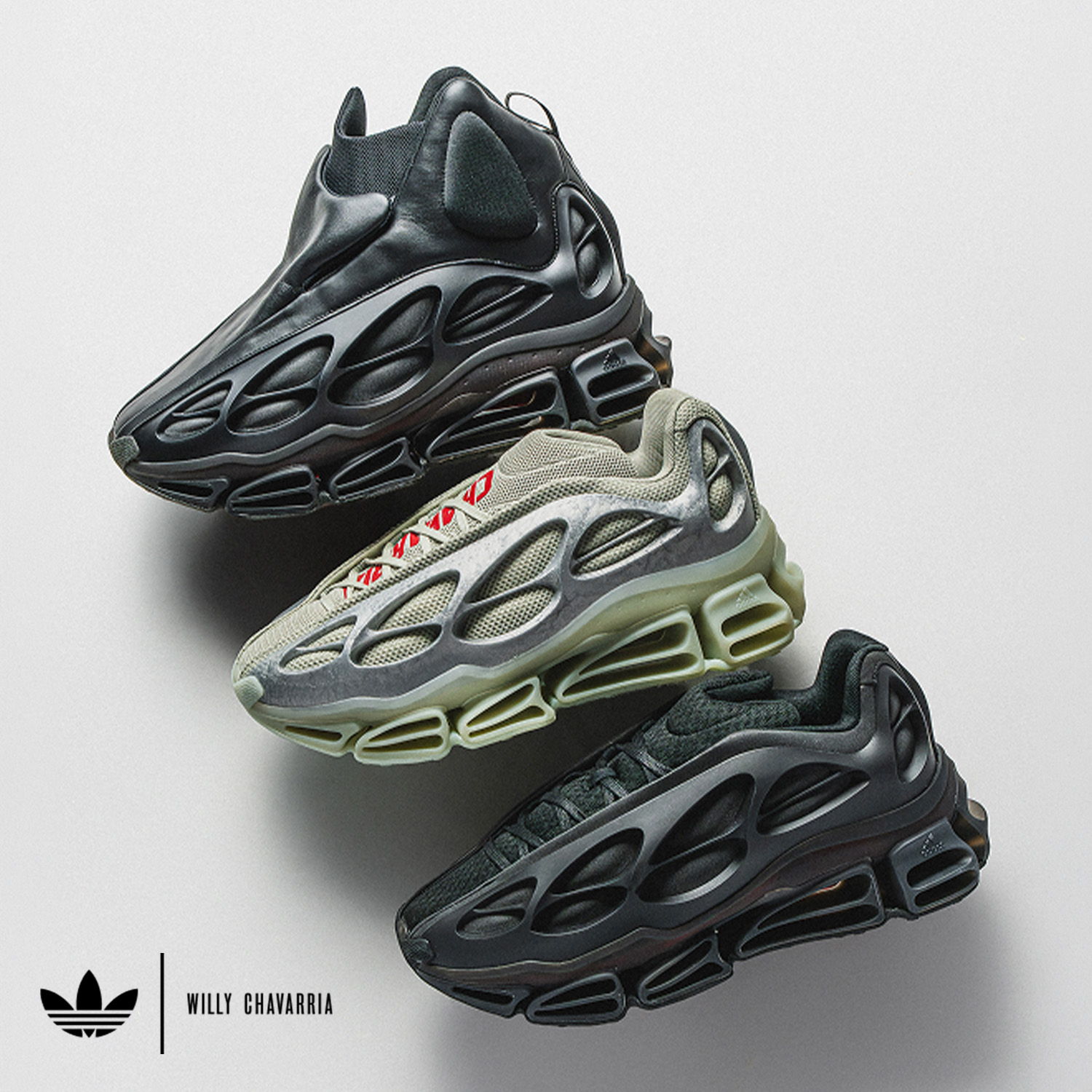 Three pairs of stylish athletic sneakers in different colors arranged on a display.
