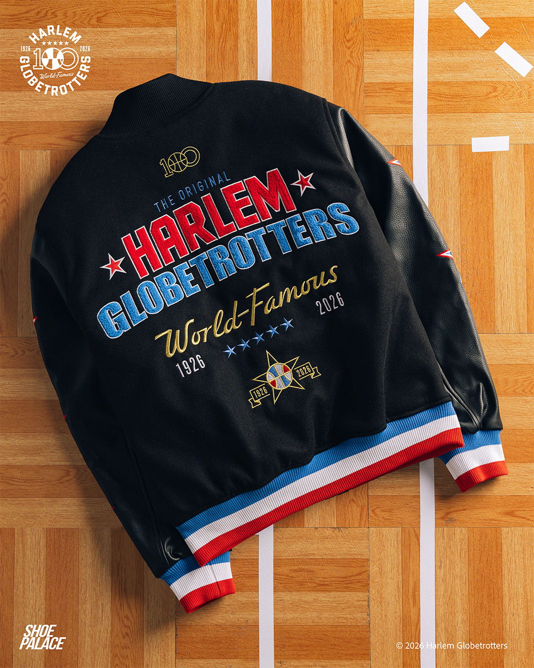 Harlem Globetrotters jacket with colorful text and design on a wooden floor.