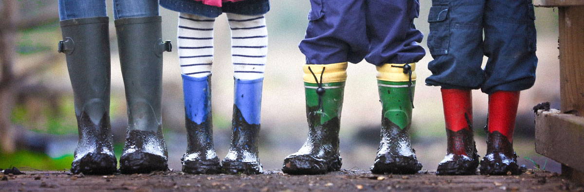 Children in muddy boots outsdoors