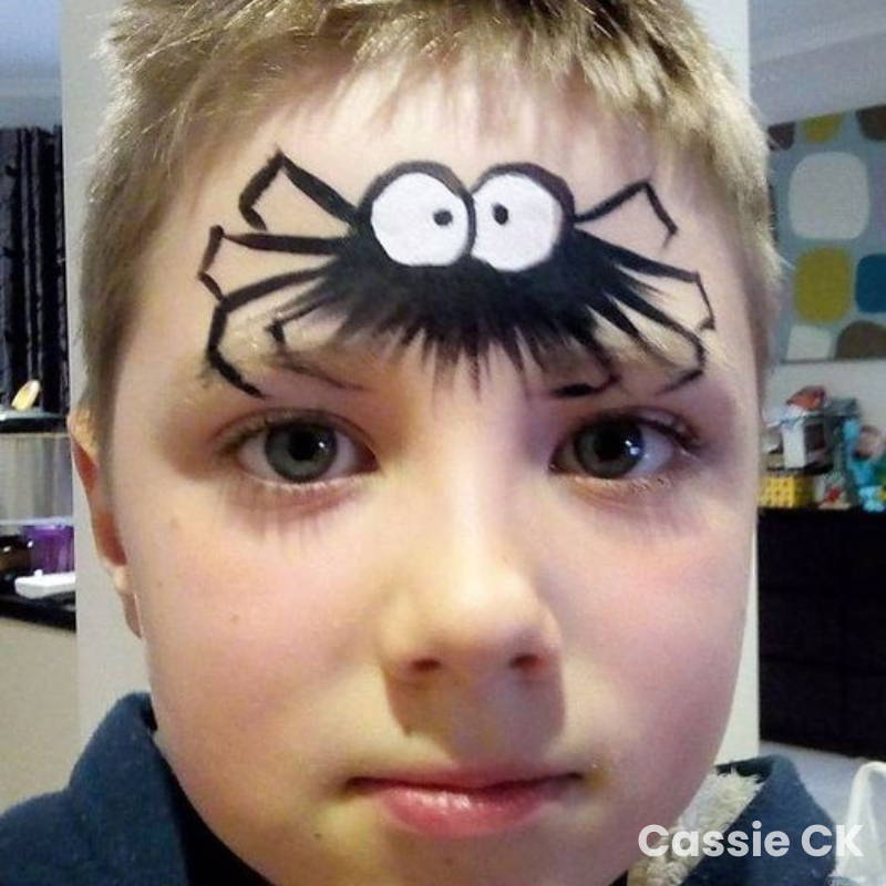 spider face paint big eyes forehead