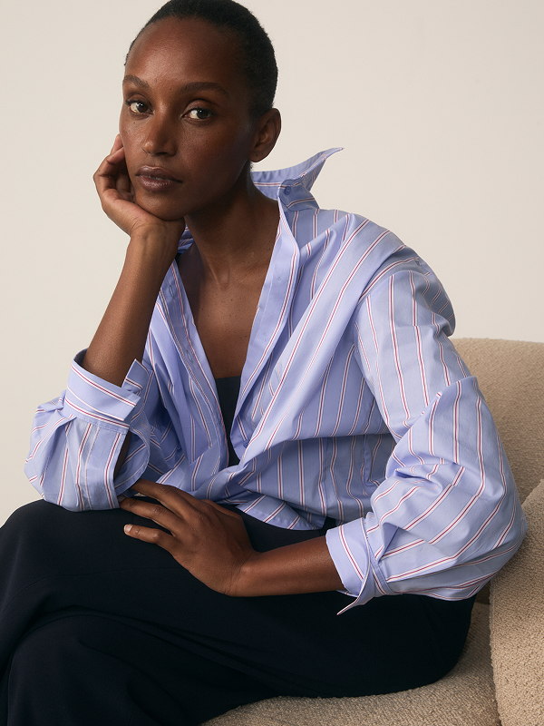 Model wearing Claudia blue stripe shirt
