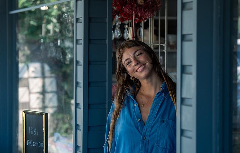 Woman standing outside a shop