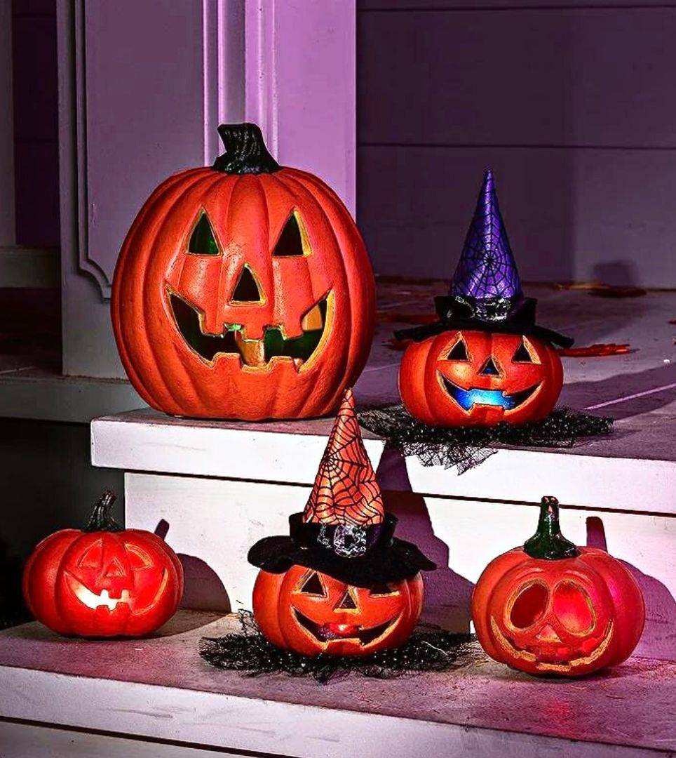 Carved pumpkins on front porch. Shop all pumpkins and pumpkin carving for Halloween.