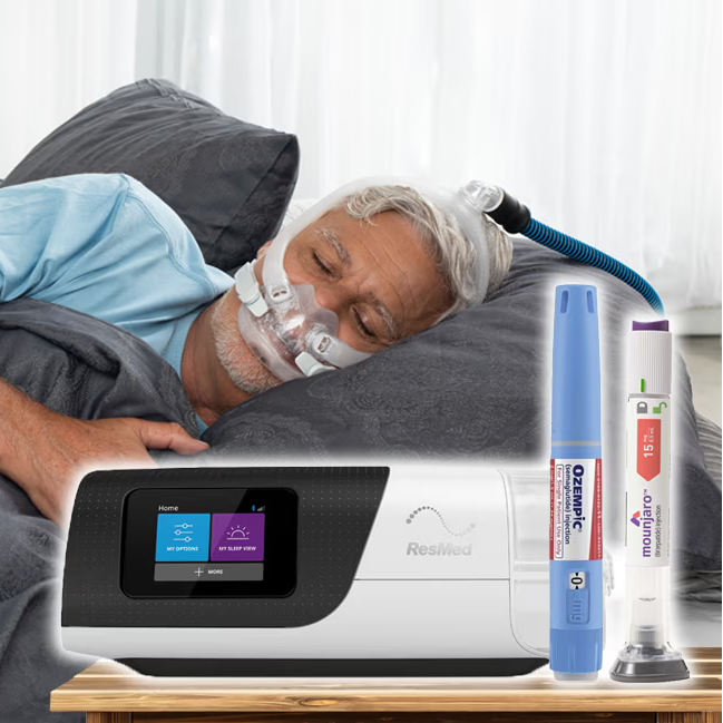 Man sleeping in bed with a CPAP machine nearby.