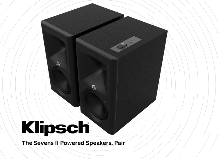 Two black speakers with a textured surface and control panel on top.