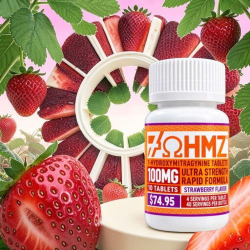 Bottle of strawberry-flavored tablets surrounded by strawberries and mint leaves.
