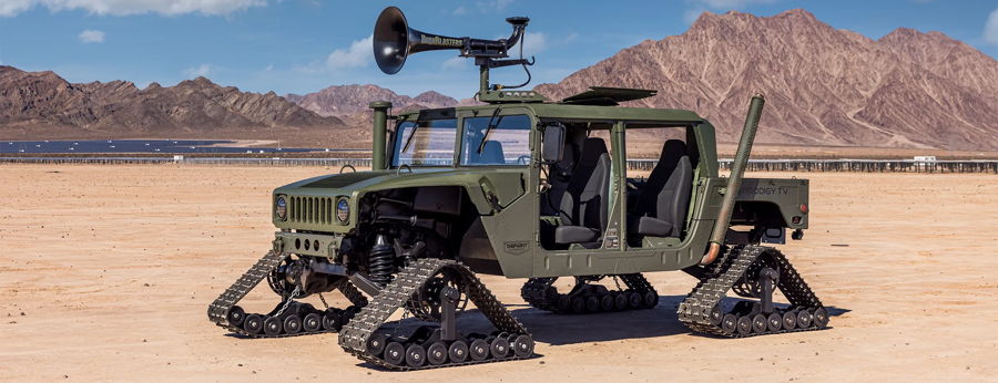 Wide panoramic olive Humvee continuous track desert mountains roof HornBlasters horns Defiant Motorsports Prodigy TV Warship KM-110 air horn featured customer install gallery photo 1