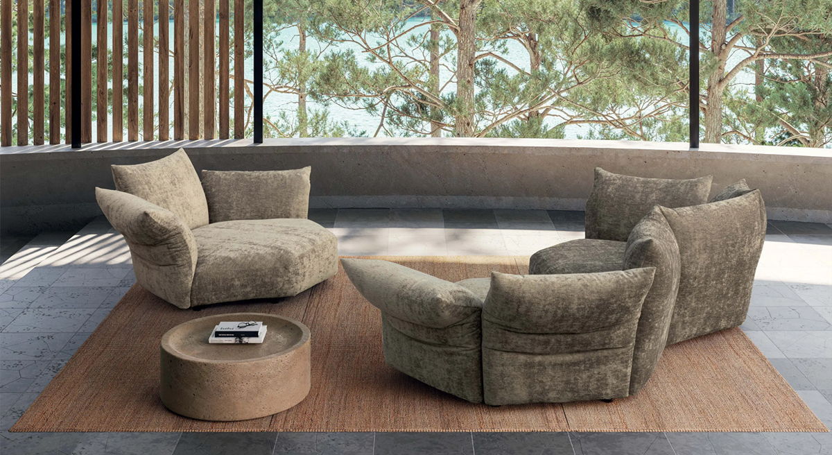 Cozy seating arrangement with two armchairs and a round table in a modern setting.