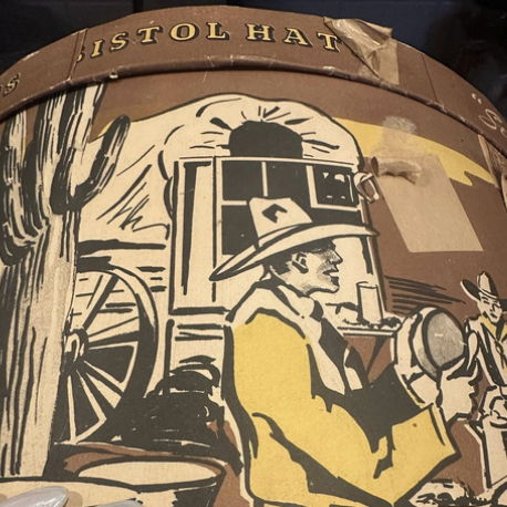 The original hat box that inspired the oil camp print