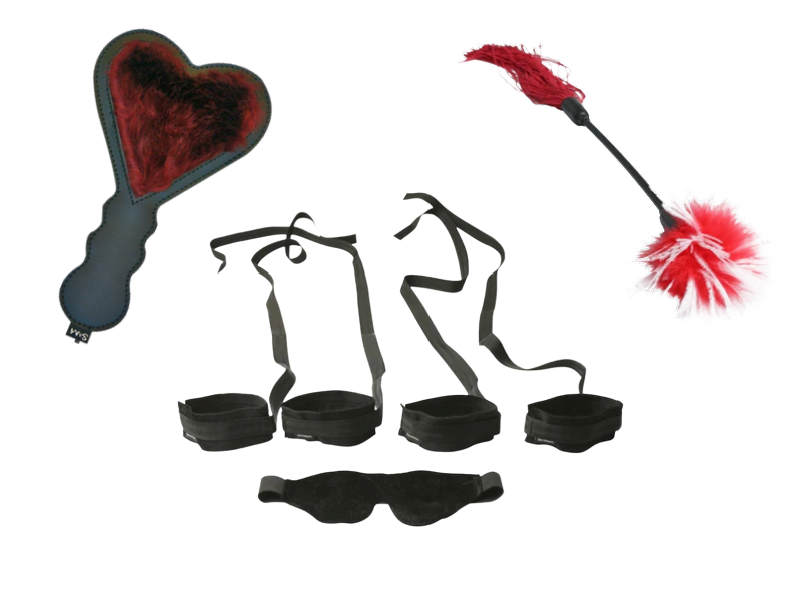BDSM kit bundle image shows the three items that come in the kit. The image shows a faux fur paddle, four bondage cuffs with attached tethers, soft blindfold, and tickler with feather attached.