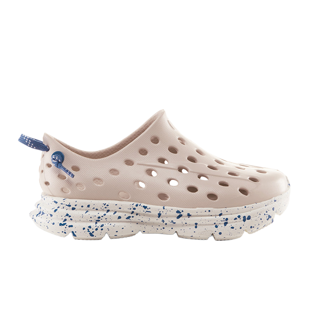 Light pink perforated slip-on shoe with a speckled white sole.
