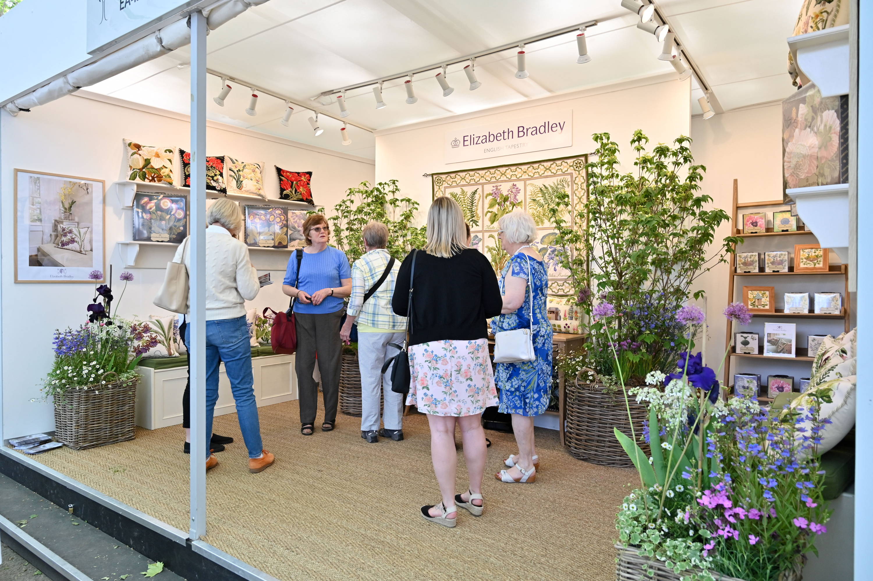 Customers talking at the Elizabeth Bradley Chelsea Flower Show booth