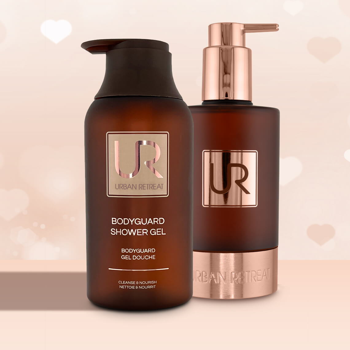 Two bottles of body care products with elegant packaging.