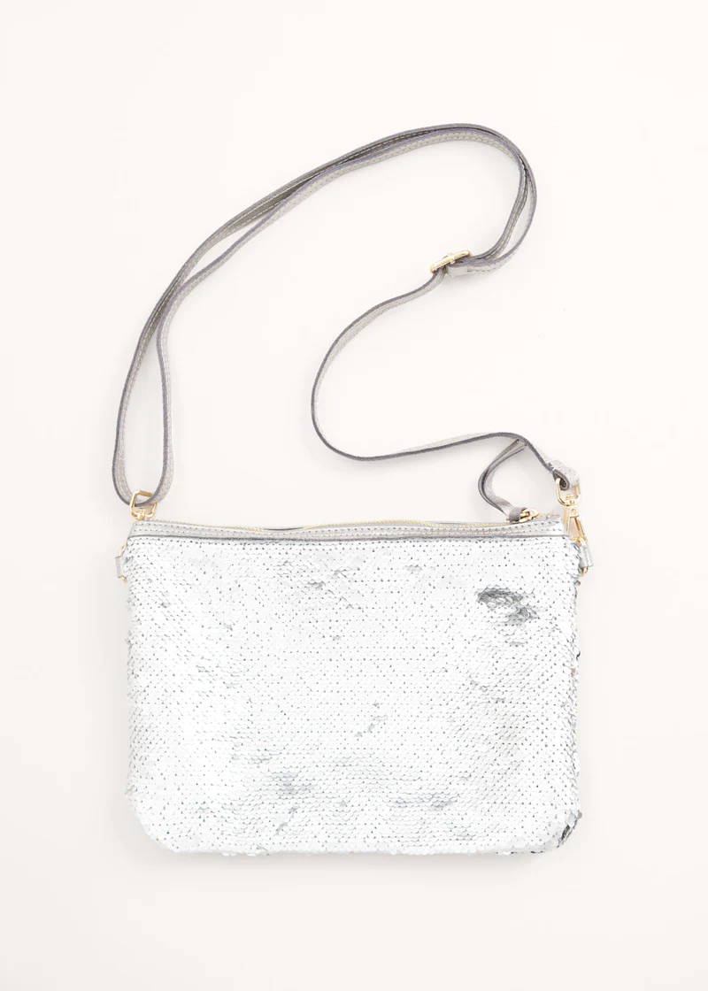 A silver sequin clutch bag with detachable strap