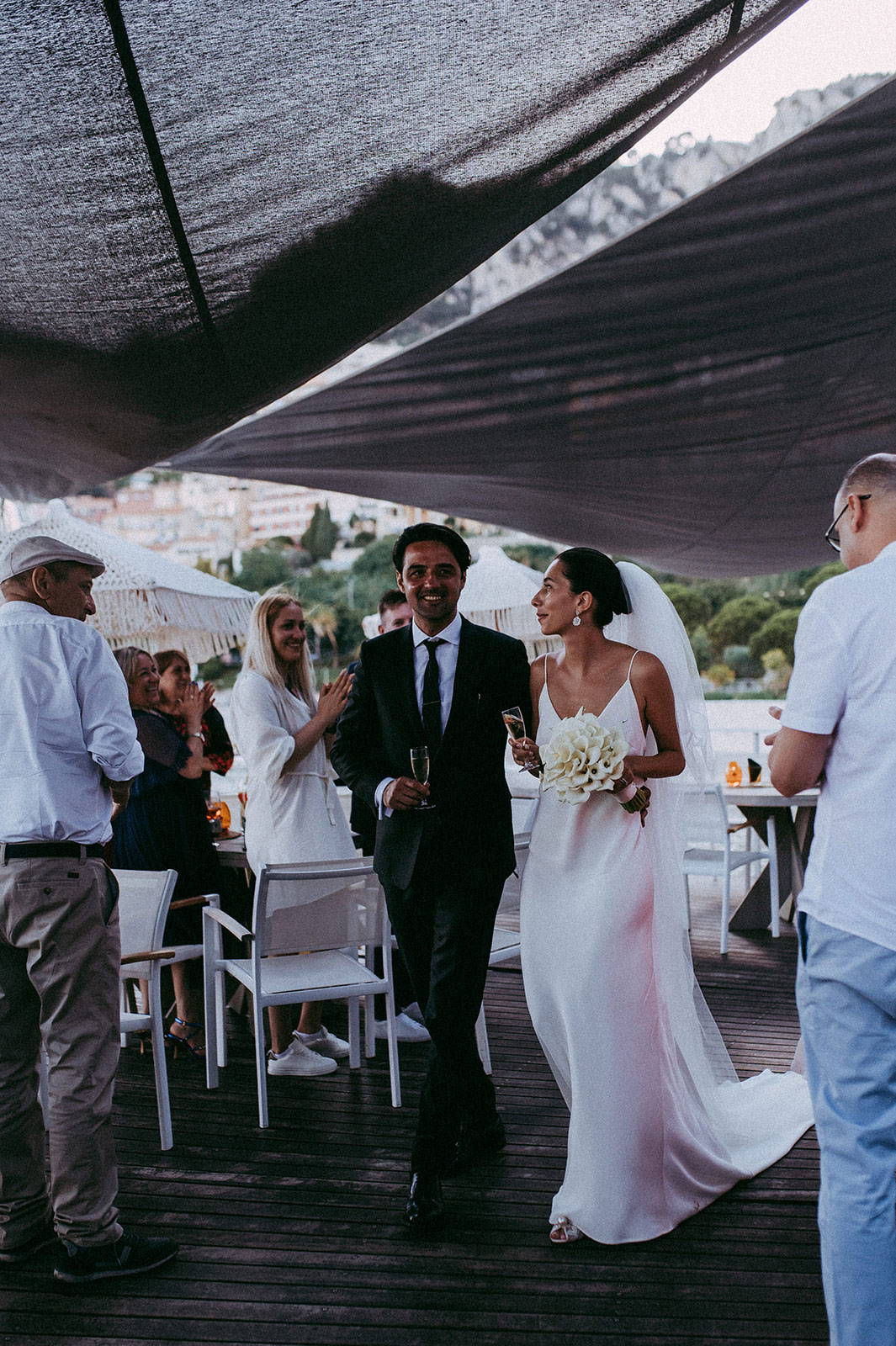 Bride and groom entering reception