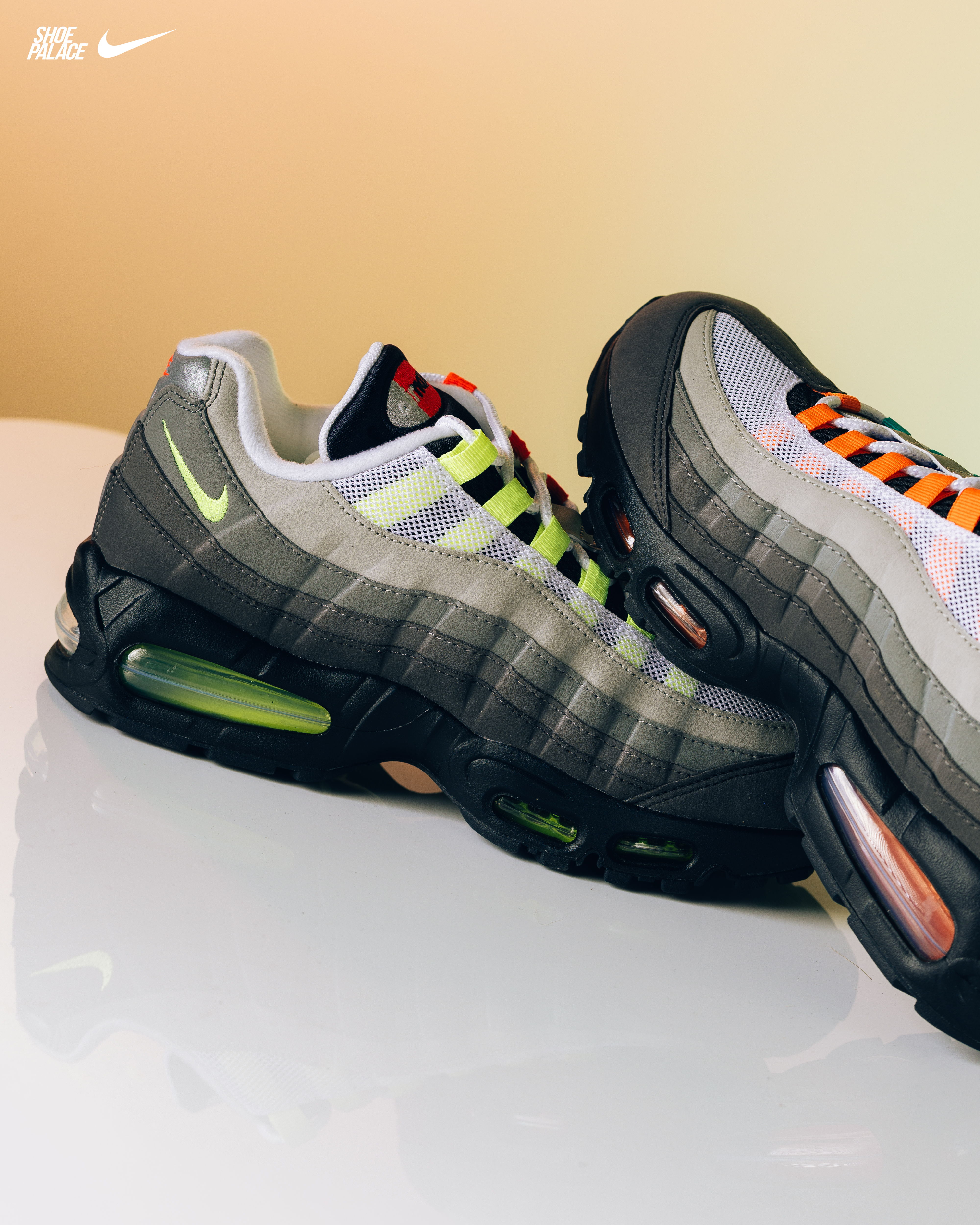 A pair of Nike sneakers with unique color patterns.