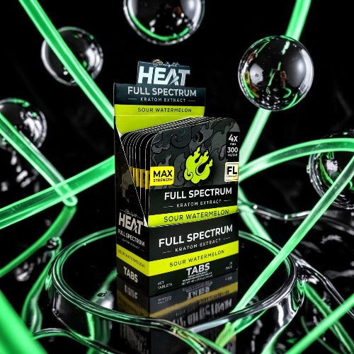Box of HEAT Full Spectrum product surrounded by glowing green elements.